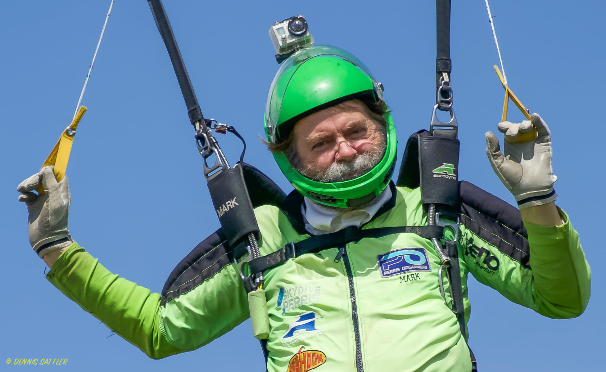 Mark Brown prepares for landing in his signature neon green jumpsuit.