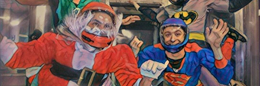 Santa Clause and Superman flying in wind tunnel
