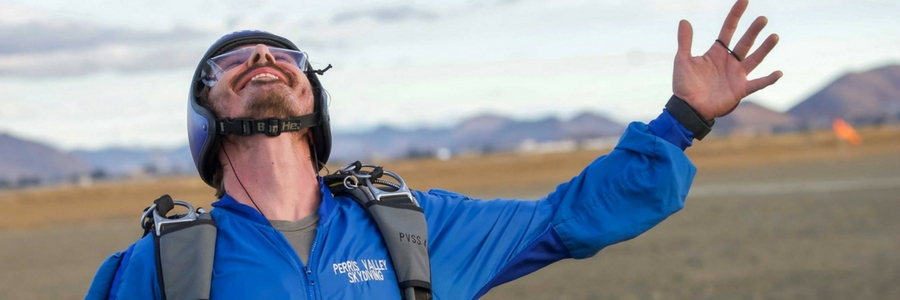 licensed skydiver looks up to the sky