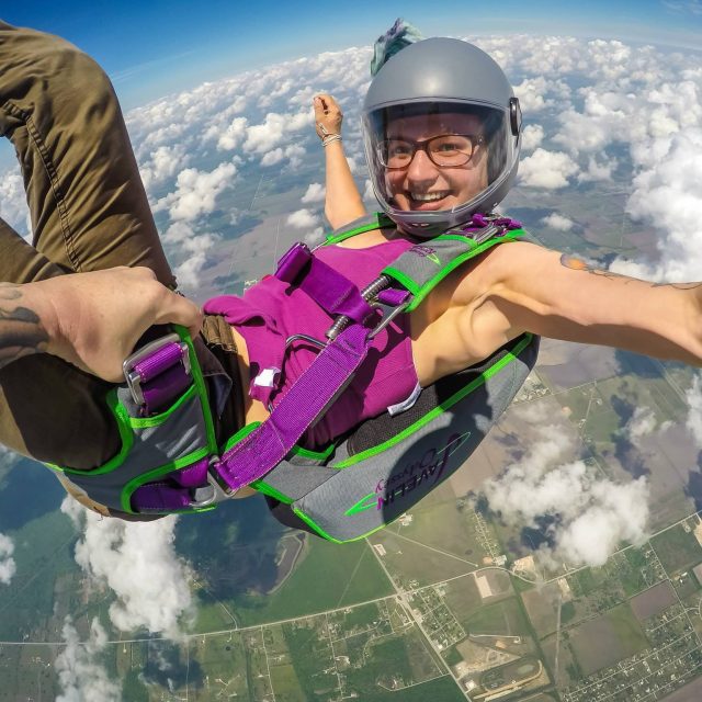 Katie Piele smiles while falling back to earth.