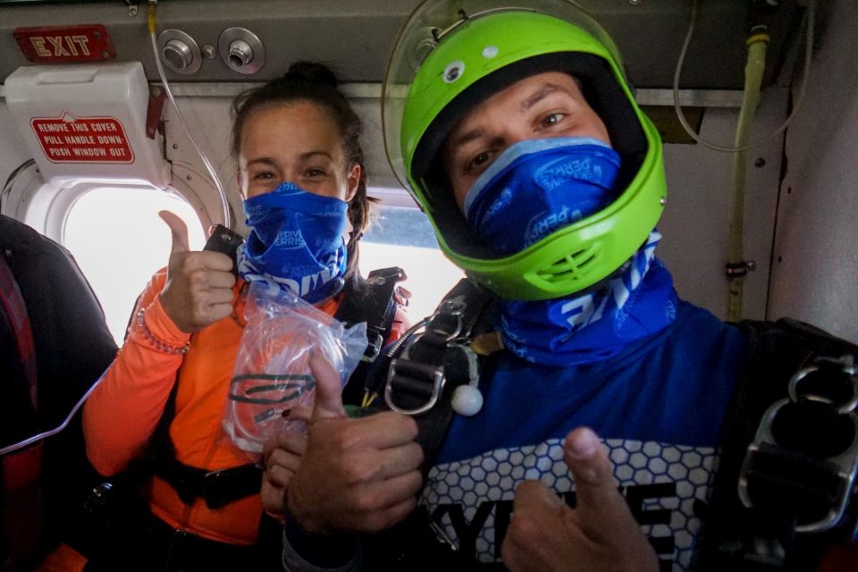 Two skydivers prepare for a jump.