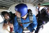 A skydiver prepares to jump from the plane.