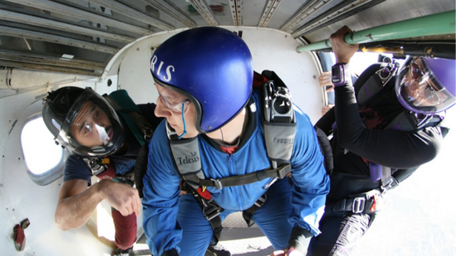 A skydiver prepares to jump from the plane.