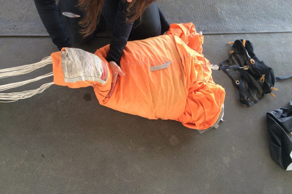 a jumper packing a parachute