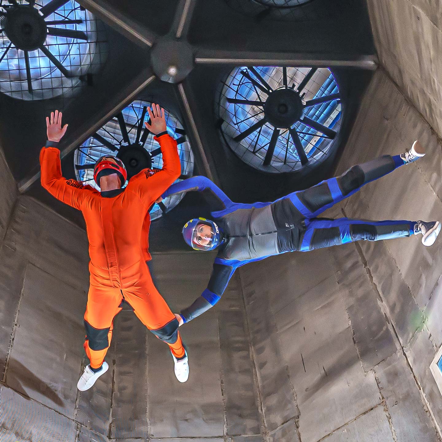an instructor and student fly high in the tunnel at Skydive Perris