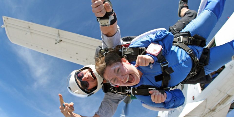 a tandem student exits from a Twin Otter at Skydive Perris near Los Angeles